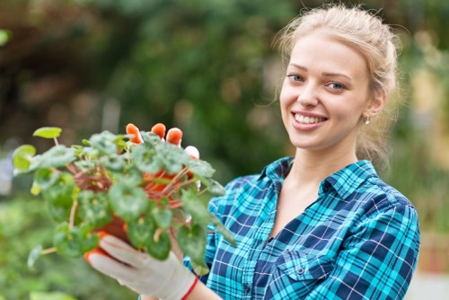 Worker applying safe landscaping practices on a managed site